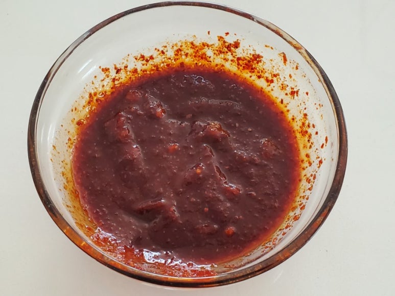 Whisking gochujang marinade